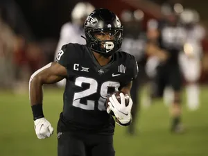 Football Player Breece Hall Action Shot Wallpaper