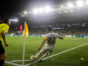 Football Player Carles Gil Kicking The Ball Wallpaper