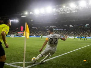 Football Player Carles Gil Kicking The Ball Wallpaper