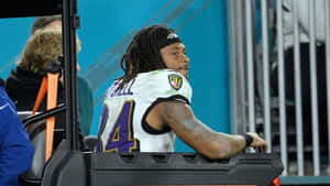 Football Player Cart Ride Wallpaper