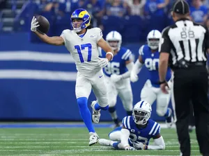 Football Player Catching Ball During Game.jpg Wallpaper