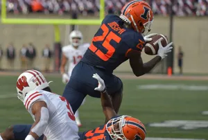 Football Player Catching Ball During Game Wallpaper