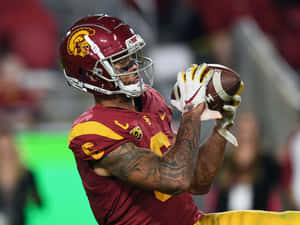 Football Player Catching Ball Wallpaper