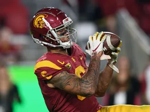 Football Player Catching Ball Wallpaper