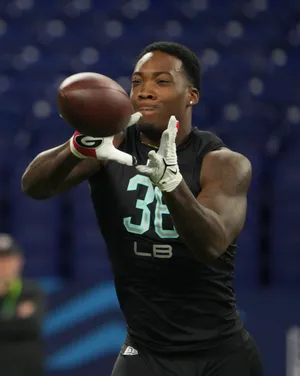 Football Player Catching Ball Wallpaper