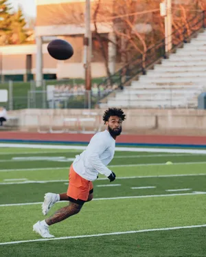 Football Player Catching Drill Wallpaper