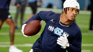 Football Player Catching Drill Wallpaper