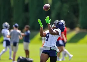 Football Player Catching Practice Wallpaper