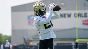 Football Player Catching Practice New Orleans Wallpaper