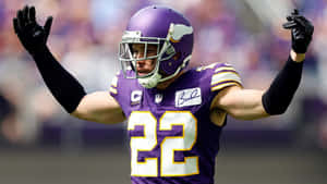 Football Player Celebrating On Field Wallpaper