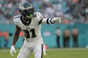 Football Player Celebrating On Field Wallpaper