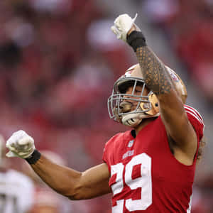 Football_ Player_ Celebrating_on_ Field Wallpaper