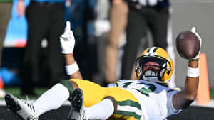 Football Player Celebrating Touchdown Wallpaper