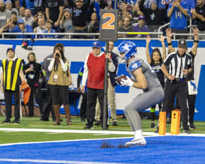 Football Player Celebrating Touchdown Wallpaper