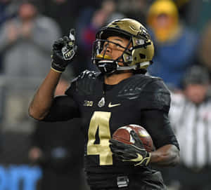 Football Player Celebrating Victory Number4 Wallpaper