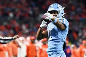 Football Player Celebratingon Field Wallpaper