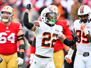 Football Player Celebratingon Field Wallpaper