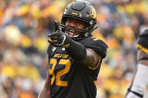 Football Player Celebratingon Field Wallpaper