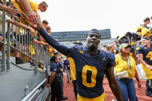 Football Player Celebratingwith Fans Wallpaper