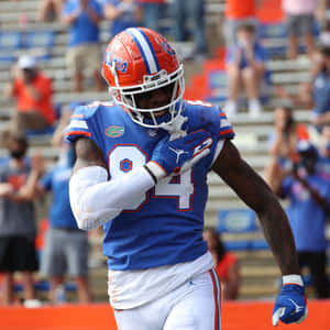 Football Player Celebration Number84 Wallpaper