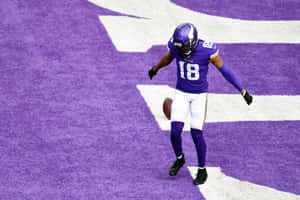 Football Player Celebration Purple Field Wallpaper