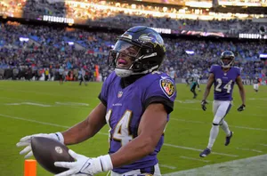 Football Player Celebrationat Stadium Wallpaper