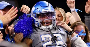 Football Player Celebrationwith Fans Wallpaper