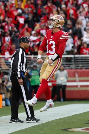 Football Player Celebrationwith Referee Wallpaper