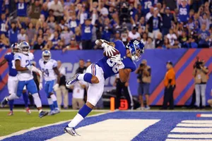 Football Player Diving Touchdown Catch Wallpaper