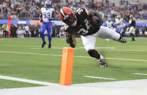 Football Player Diving Touchdown Wallpaper