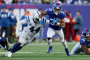 Football Player Evading Tackle Wallpaper