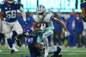 Football Player Evading Tackle Wallpaper