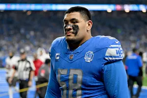 Football Player Field Presence Wallpaper