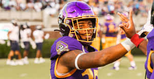 Football Player Gesture During Game Wallpaper