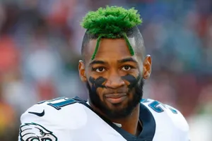 Football Player Green Hair Portrait Wallpaper