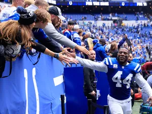 Football Player High Fiving Fans Wallpaper