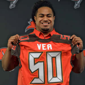 Football Player Holding Jersey Number50 Wallpaper