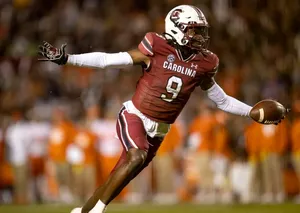 Football Player In Action Carolina Uniform Wallpaper