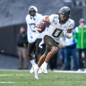 Football Player In Action Wallpaper