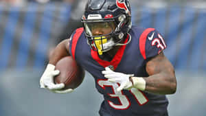 Football Player In Action During Game Wallpaper