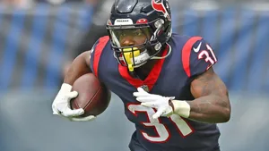 Football Player In Action During Game Wallpaper