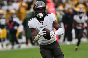 Football Player In Action During Game Wallpaper