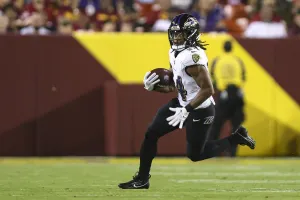 Football Player In Action During Game Wallpaper