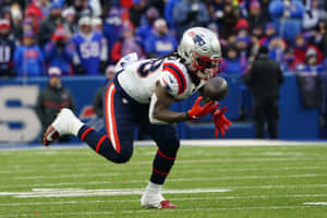 Football Player In Action During Game.jpg Wallpaper