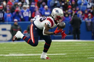 Football Player In Action During Game.jpg Wallpaper