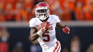 Football Player In Action During Game.jpg Wallpaper