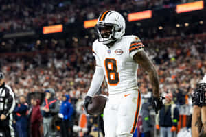 Football Player In Action During Game Wallpaper