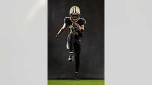 Football Player In Action Portrait Wallpaper