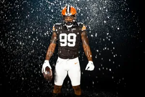 Football_ Player_in_ Rain_99_ Jersey Wallpaper