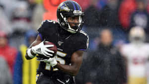 Football Player In Rain Game Action Wallpaper